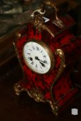 A FRENCH ORMOLU MOUNTED MANTLE CLOCK