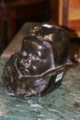 A 19THC/20THC BRONZE PORTRAIT BUST OF A CHILD INDISTINCTLY INSCRIBED ON REVERSE