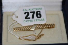 A GOLD TIE CLIP.750 grade . approx 5 grams gross