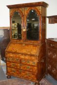 AN EARLY GEORGIAN BURR WALNUT MIRROR DOOR BUREAU BOOKCASE