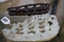 A CHINESE CARVED JADE FIGURAL GROUP, FOUR FIGURES WITHIN A PIERCED SCROLL SURROUND AND A CARVED