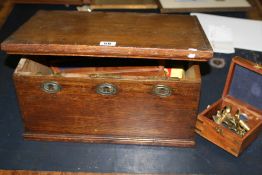 AN ANTIQUE OAK BOX TOGETHER WITH VARIOUS BRASS NAUTICAL INSTRUMENTS,ETC