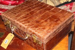 AN EDWARDIAN LEATHER VANITY CASE