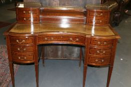 AN EARLY 20TH.C.MAHOGANY ROSEWOOD AND SATINWOOD BANDED INVERTED BOW FRONT WRITING DESK WITH RAISED