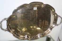 A LARGE HALLMARKED SILVER OVAL SHAPED EDGE TWO HANDLED TRAY.