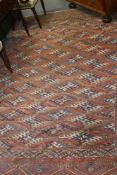 AN ANTIQUE TURKOMAN MAIN CARPET. 298 X 188 CMS