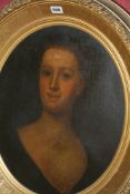 AN 18TH.C.ENGLISH SCHOOL OVAL PORTRAIT OF A LADY OIL ON CANVAS, LAID ON BOARD. 52X40 CMS