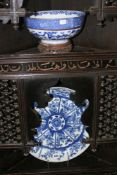 TWO PIECES OF ORIENTAL BLUE AND WHITE PORCELAIN, A DEEP BOWL AND A LARGE SAUCER WITH RADIATING