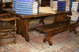 A BESPOKE OAK TRESTLE END REFECTORY TABLE WITH MATCHING FORMS AND CARVED ARMCHAIRS