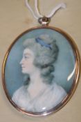 A GEORGIAN OVAL MINIATURE WATERCOLOUR PORTRAIT OF A LADY, THE YELLOW METAL FRAME WITH BLANK