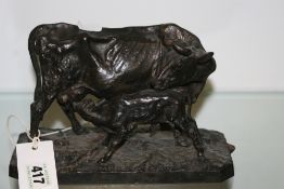 AFTER P J MENE. A 19TH.C.PATINATED IRON GROUP OF A COW WITH CALF, POSSIBLY RUSSIAN, SIGNED