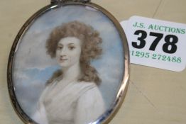 15TH-19TH.ENGLISH SCHOOL. A MINIATURE OVAL PORTRAIT OF A LADY IN A WHITE DRESS. WATERCOLOUR.