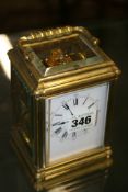 A BRASS CASED STRIKING CARRIAGE CLOCK.
