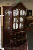 A CONTINENTAL MAHOGANY DISPLAY CABINET ON CHEST