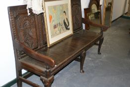 AN 18TH.C.CARVED OAK HALL SETTLE