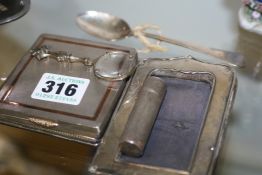 A SILVER COMPASS, A CIGARETTE CASE, LIPSTICK, MAGNIFYING GLASS, FRAME AND TWO SPOONS