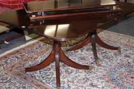 A BESPOKE MAHOGANY EXTENDING TABLE