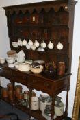 AN OAK POTBOARD DRESSER AND RACK