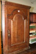 A GEORGIAN OAK CORNER CABINET