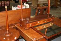 AN INLAID MAHOGANY SWING MIRROR AND A STANDARD LAMP