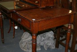 A VICTORIAN MAHOGANY TWO DRAWER WRITING TABLE