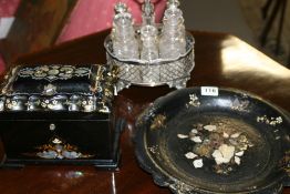 A VICTORIAN PAPIER MACHE TEA CADDY, A SIMILAR PLATE AND A SILVERPLATED FIVE BOTTLE CRUET SET