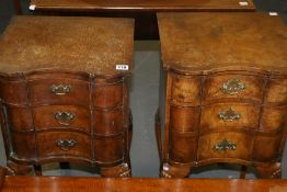 A PAIR OF WALNUT THREE DRAWER BEDSIDE TABLES
