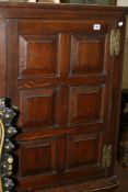 A GEORGIAN OAK PANEL DOOR CORNER CABINET