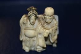 A 19TH CENTURY IVORY NETSUKE.