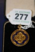 A GOLD AND ENAMEL ATHLETICS MEDAL9ct gold. approx 13.5 grams gross