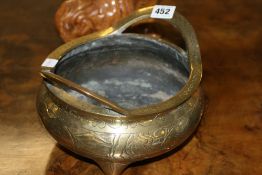 AN ORIENTAL BRASS CENSER WITH FLARING HANDLES, PHOENIX BIRD DECORATION AND UNDERFOOT DRAGON