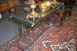 A CONTEMPORARY CHROME AND GLASS HALL TABLE