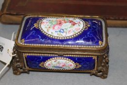 A FRENCH 19TH.C. ENAMEL DRESSING TABLE BOX, SHADED BLUE SCROLL PANELS WITH OVAL POLYCHROME