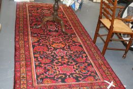 A PERSIAN HAMADAN RUNNER. 290 X 130 CMS