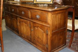 A BESPOKE OAK FOUR DRAWER DRESSER BASE