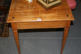 A CONTINENTAL FRUITWOOD AND EBONY BANDED OCCASIONAL TABLE