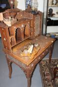 A MOORISH CARVED AND INLAID HARDWOOD WRITING TABLE