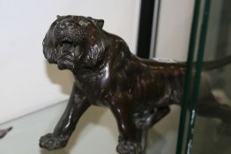 A JAPANESE BRONZE OF A TIGER INCISED SIGNATURE. LENGTH 40cms