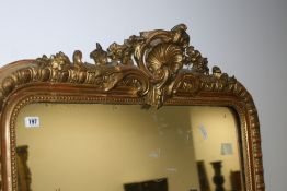 A VICTORIAN GILT FRAMED OVERMANTLE MIRROR