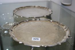 A NEAR PAIR OF HALLMARKED SILVER SHAPED EDGE TRAYS, ONE WITH ENGRAVED DECORATION.