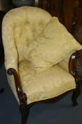 AN EARLY VICTORIAN ROSEWOOD FRAMED BUTTON BACK ARMCHAIR