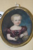 19TH.C.ENGLISH SCHOOL. AN OVAL MINIATURE PORTRAIT OF A CHILD HOLDING A BALL AND  BASKET.