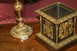 AN ORMOLU CANDLESTICK CONVERTED AS LAMP TOGETHER WITH AN ORMOLU MOUNTED STAND WITH CHERUB