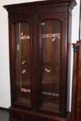 A MAHOGANY GLAZED BOOKCASE