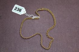 A 9CT GOLD CURB LINK NECKLACE. APPROX. 44 GRAMS.