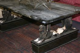 AN UNUSUAL GLASS TOPPED COFFEE TABLE WITH SPHINX SUPPORTS