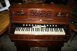 A VICTORIAN HARMONIUM