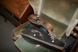 AN ITALIAN MANDOLIN AND A MANTLE CLOCK