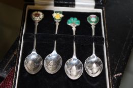 FOUR HALLMARKED SILVER AND ENAMEL SOUVENIR SPOONS AND OTHER ITEMS.