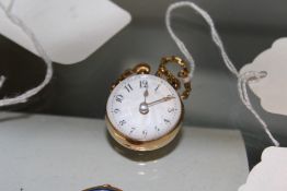 A GOLD MOUNTED BULL`S EYE FOB WATCH.